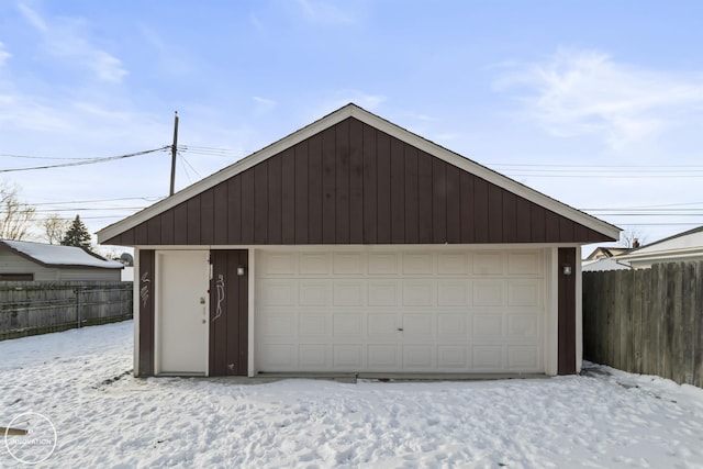 view of snow covered garage