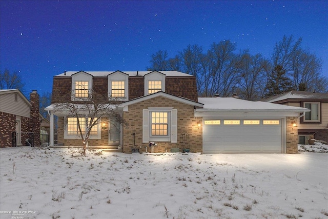 view of front of property with a garage