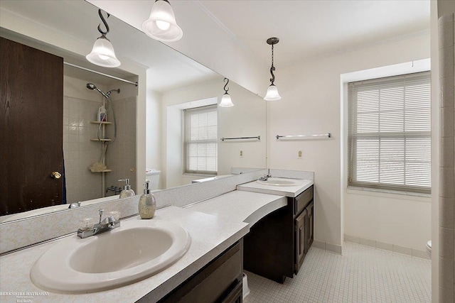 bathroom featuring toilet, walk in shower, tile patterned floors, and vanity