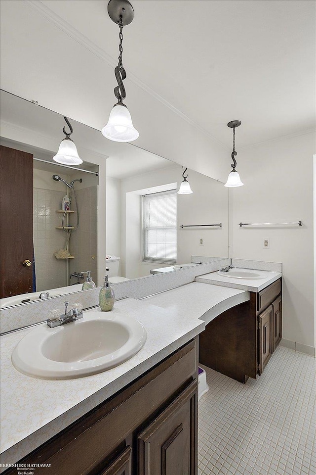 bathroom with tiled shower / bath combo, tile patterned floors, and vanity