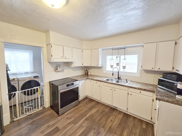 kitchen with white cabinets, appliances with stainless steel finishes, sink, and plenty of natural light