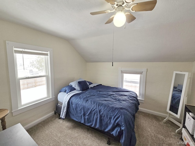 carpeted bedroom with ceiling fan and lofted ceiling