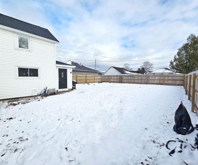 view of yard layered in snow