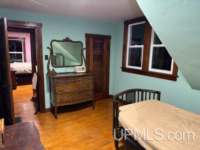 bedroom with light hardwood / wood-style flooring