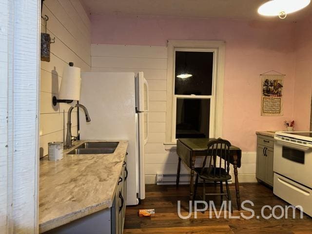 kitchen featuring light stone countertops, sink, dark hardwood / wood-style floors, electric range, and gray cabinetry