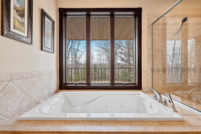 bathroom featuring tiled bath