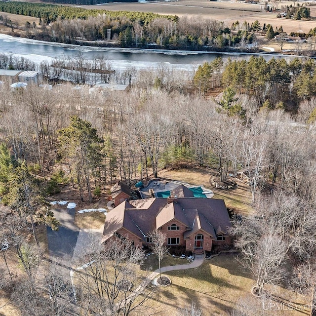 birds eye view of property with a water view