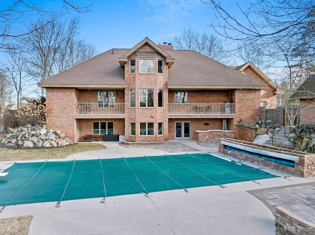 view of pool with a patio area and a jacuzzi