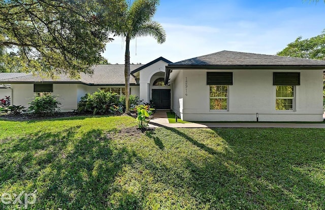 ranch-style home with a front yard