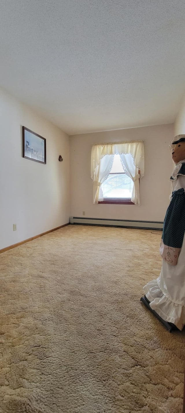 carpeted spare room with a textured ceiling