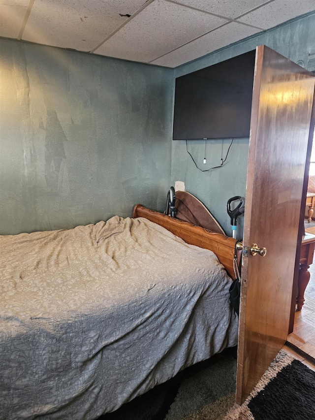 bedroom featuring a paneled ceiling