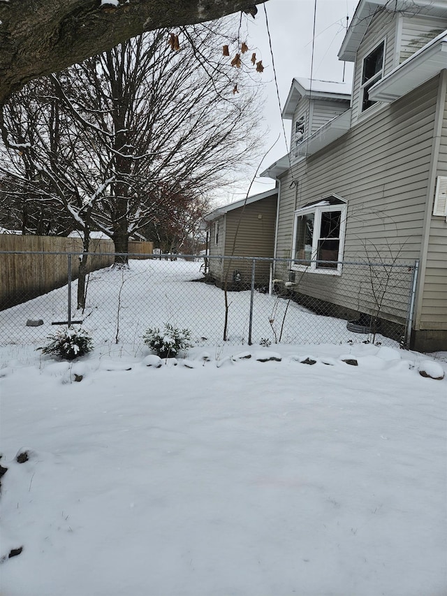 view of yard covered in snow