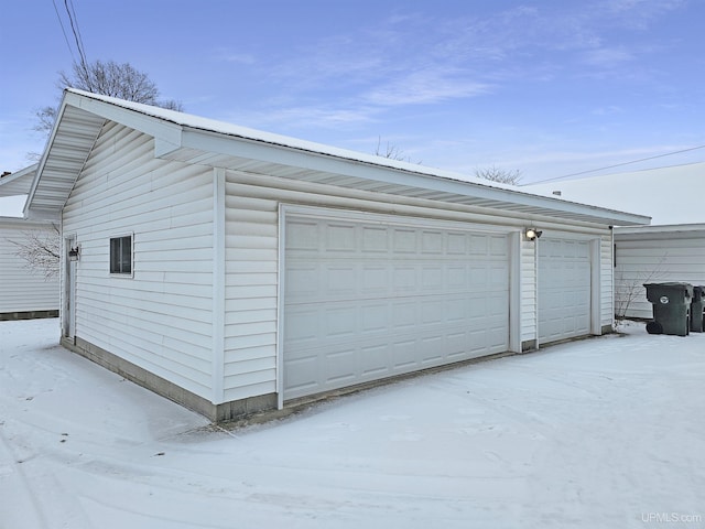 view of snow covered garage