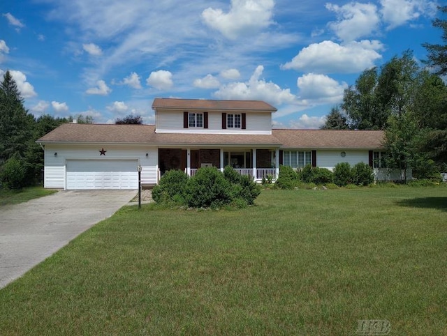 view of front of property featuring a garage, a front yard, and a porch