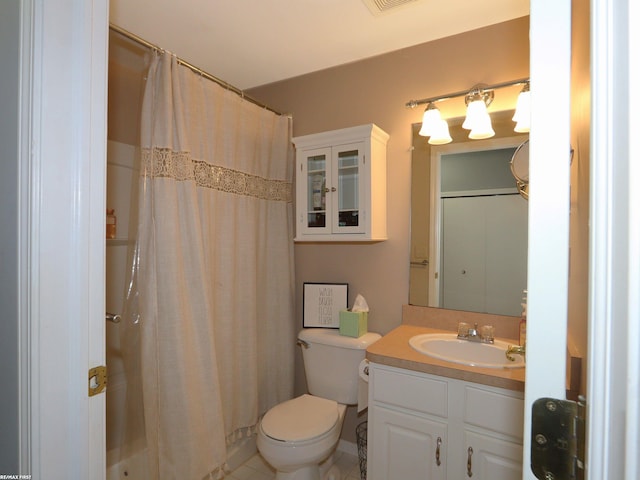 bathroom with toilet, tile patterned flooring, walk in shower, and vanity