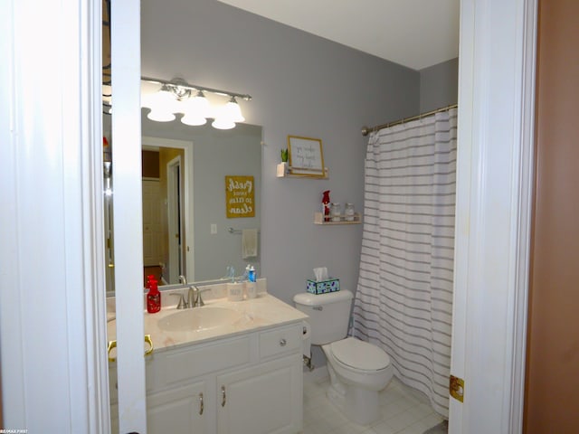 bathroom with toilet, vanity, a shower with curtain, and tile patterned floors