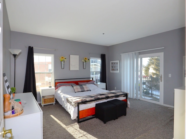 carpeted bedroom featuring access to exterior