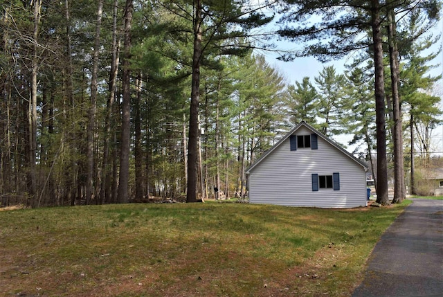 view of home's exterior with a lawn