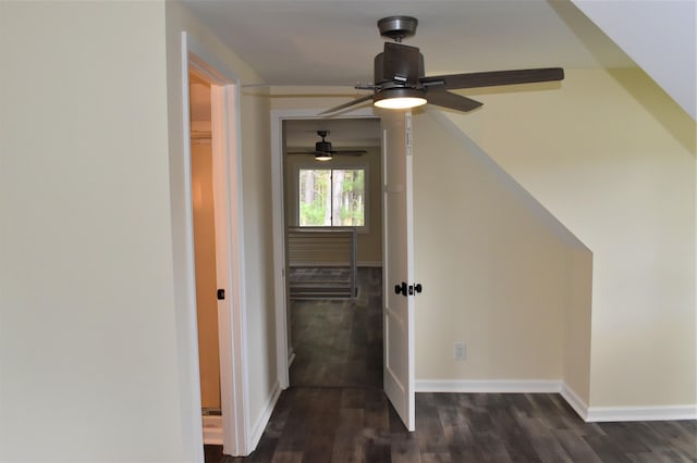 hallway with dark hardwood / wood-style flooring