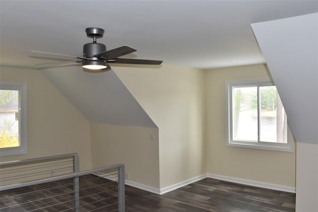 bonus room featuring ceiling fan, plenty of natural light, dark hardwood / wood-style flooring, and lofted ceiling