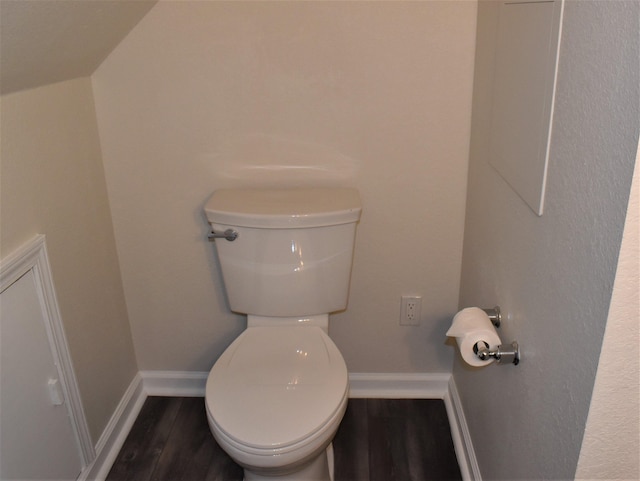 bathroom with toilet and hardwood / wood-style flooring