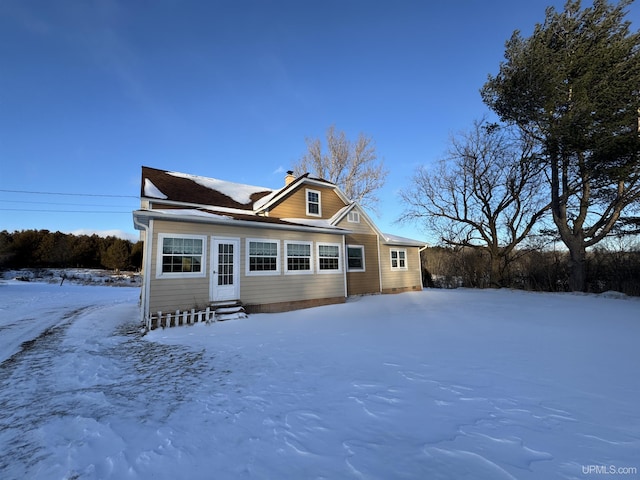 view of snow covered house