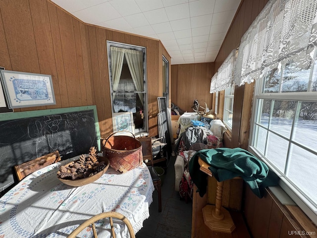 miscellaneous room featuring wooden walls