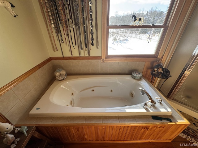 bathroom with tiled bath