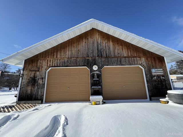 view of snow covered garage