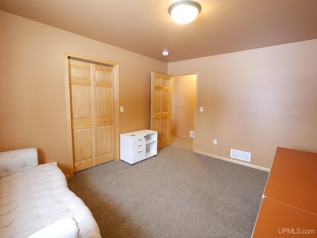 carpeted bedroom featuring a closet