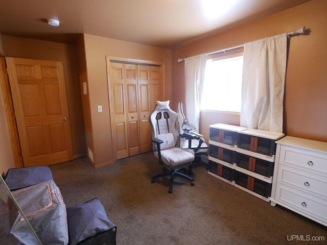 living area featuring dark carpet