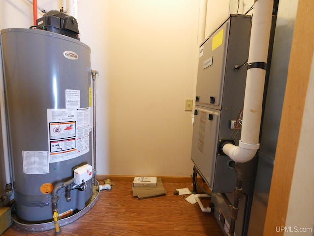 utility room with water heater and heating unit