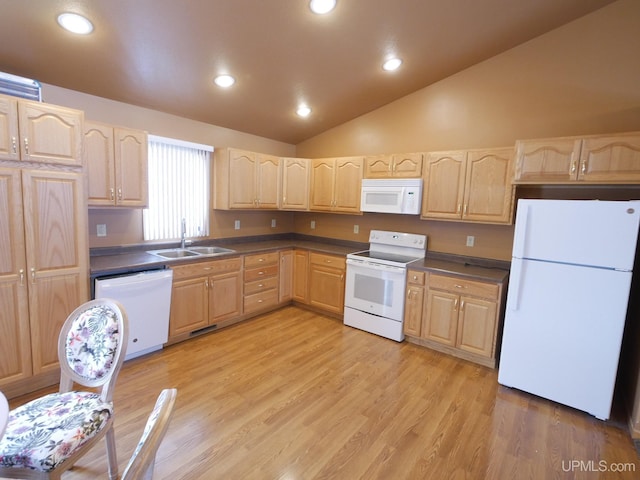 kitchen featuring white appliances, lofted ceiling, light brown cabinets, sink, and light hardwood / wood-style flooring