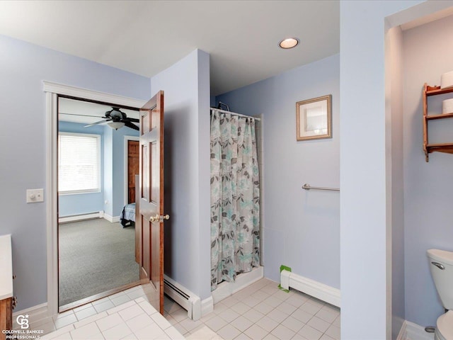 bathroom with ceiling fan, a shower with curtain, and a baseboard radiator