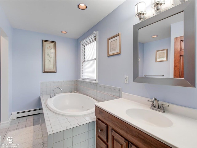 bathroom with vanity, a relaxing tiled tub, and a baseboard radiator