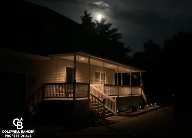 view of front of property with a wooden deck