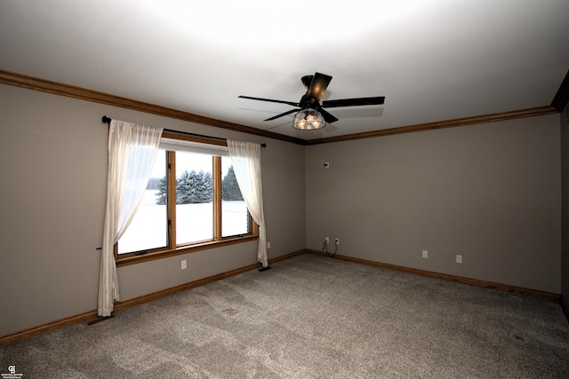 carpeted spare room featuring crown molding and ceiling fan