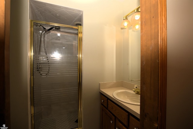 bathroom featuring vanity and a shower with shower door