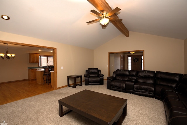 living room with light colored carpet, ceiling fan with notable chandelier, and vaulted ceiling with beams