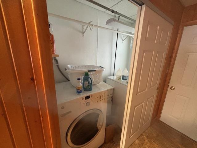 washroom with washer / dryer