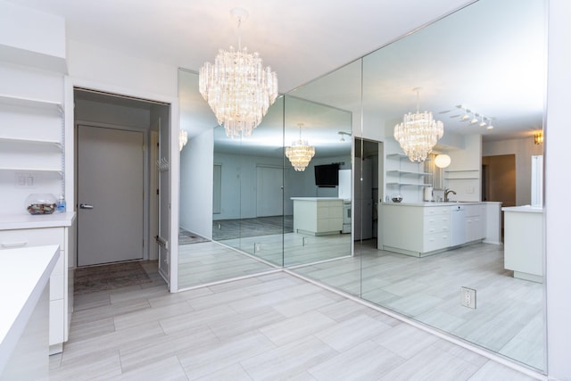 interior space featuring vanity and a notable chandelier