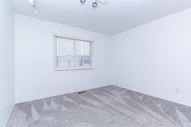 unfurnished room with carpet flooring