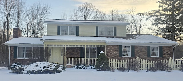 view of property featuring covered porch