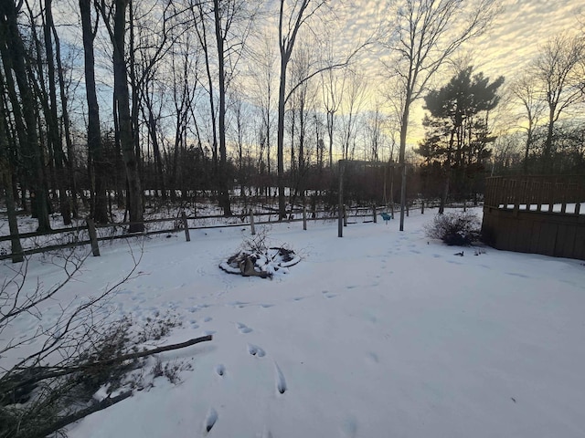 view of yard layered in snow