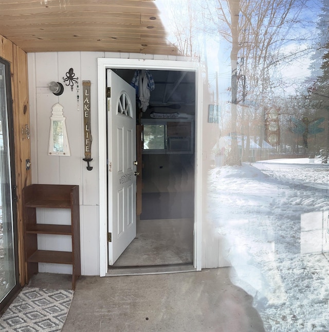 view of snow covered property entrance