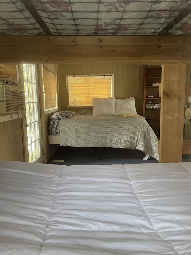 bedroom with wooden walls