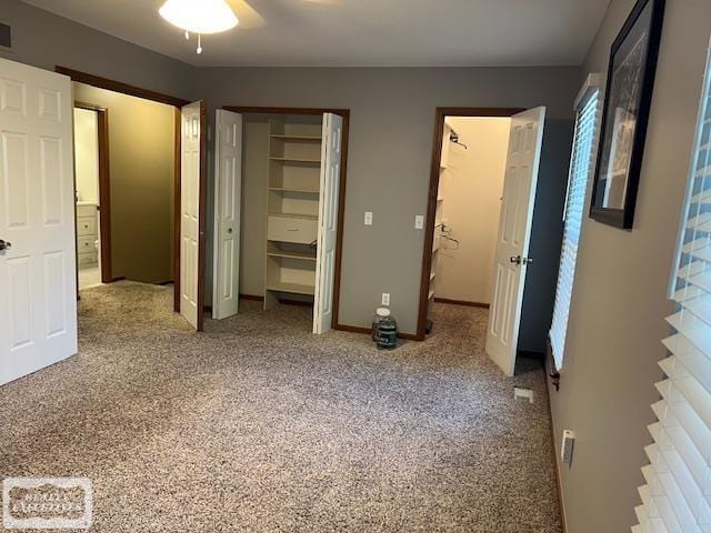 unfurnished bedroom featuring ceiling fan and carpet flooring