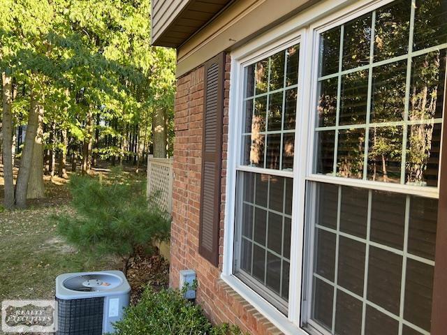 view of property exterior with central AC unit