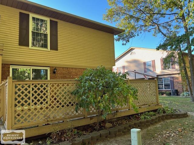 view of side of property featuring a deck