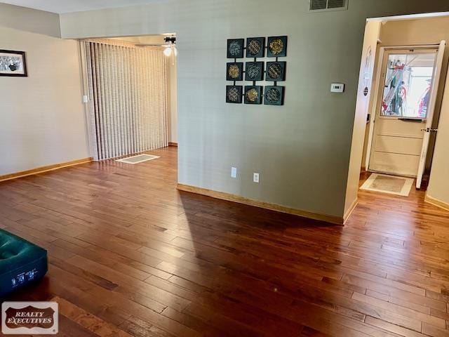 spare room with wood-type flooring